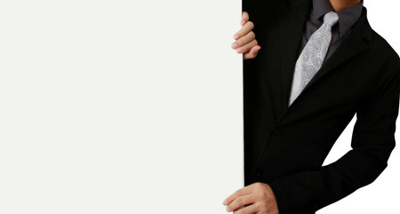 Business man handing a blank business card over の写真素材