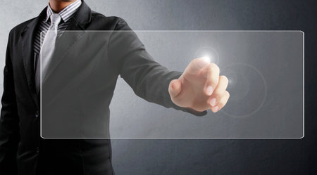 hand pushing on  touch screen interface の写真素材