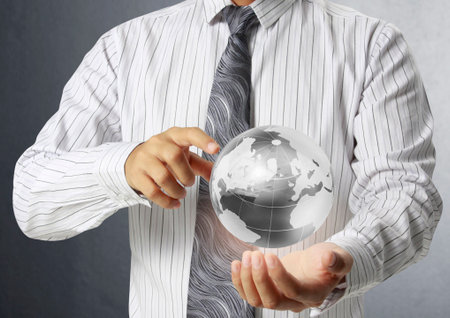 holding a glowing earth globe in his hands, Elements of this image furnished by NASA の写真素材