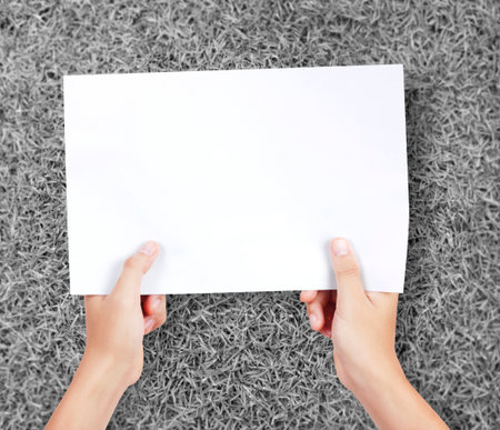 Business man handing a blank business card over の写真素材