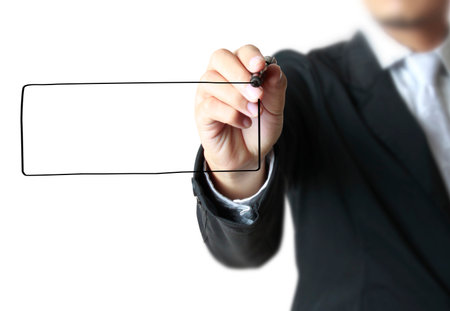 Business man hand drawing in the whiteboard の写真素材