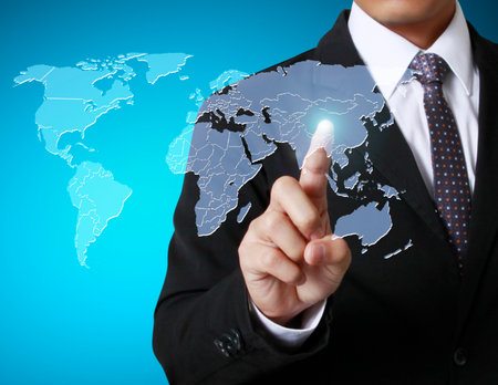 hand pushing a world mapの写真素材