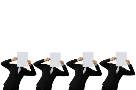 Business man handing a blank business a4 card over の写真素材