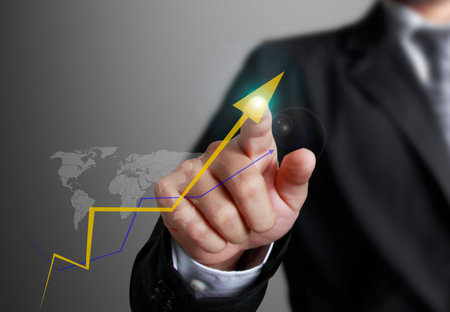 business man pointing at growth graph and business conceptの写真素材