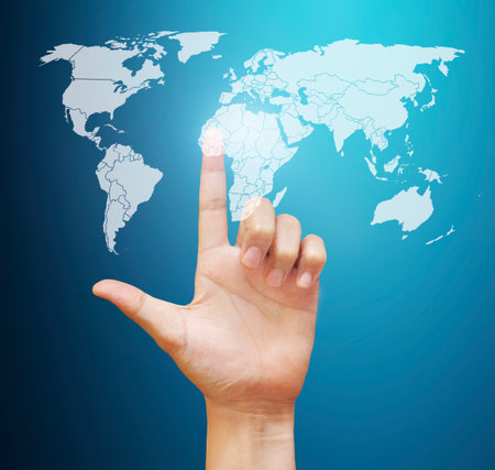 Finger pressing the touch screen displayの写真素材