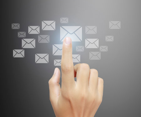 businessman with financial symbols coming from handの写真素材