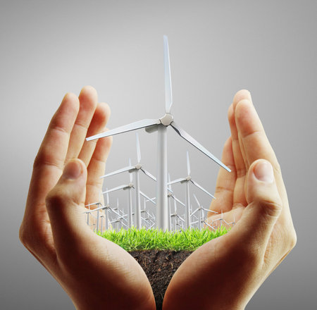 Eco power, wind turbines  in the handの写真素材