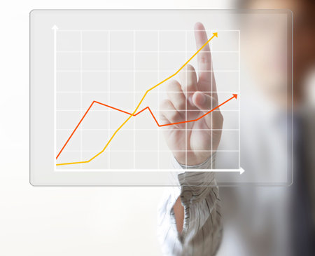 Touch Screen financial symbols coming from handの写真素材