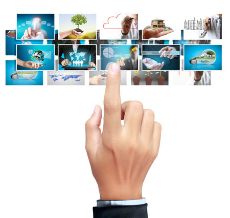 Businessman touch screen to choose digital photosの写真素材
