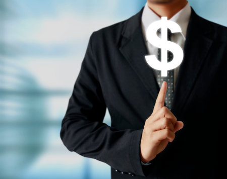 businessman with financial symbols coming from handの写真素材