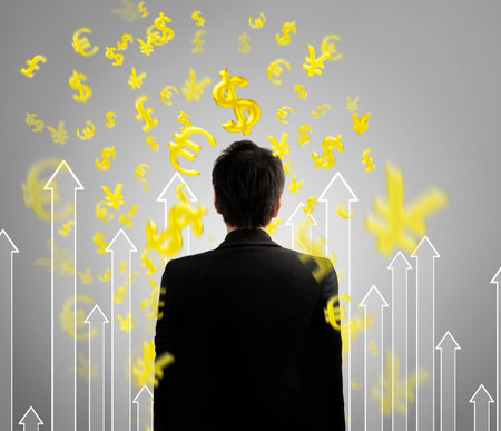 Businessman with financial symbols comingの写真素材