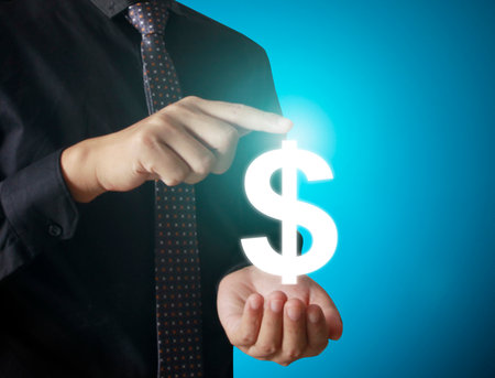 Man touching online button with money icon, money conceptの写真素材