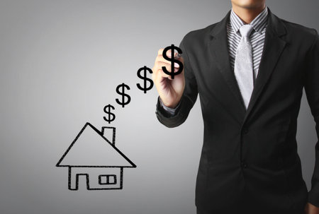 Businessman drawing a houseの写真素材