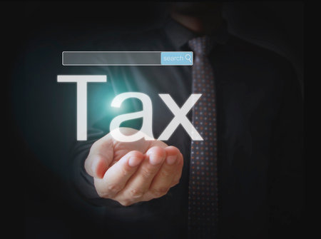 businessman tax in a handの写真素材