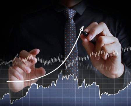 Businessman drawing graphics a growing graphの写真素材