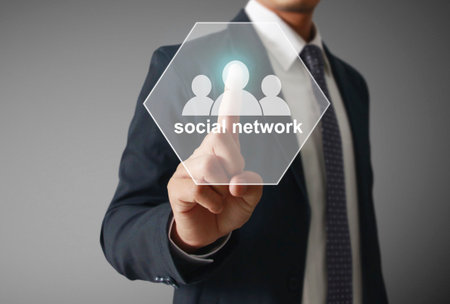 male touching virtual icon of social networkの写真素材