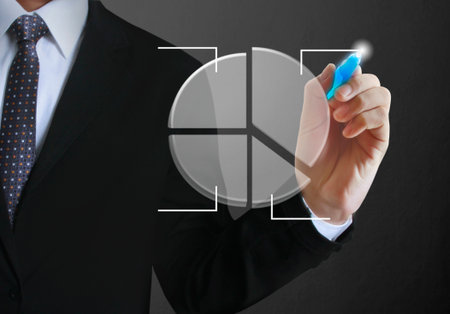 Businessman drawing graphics a growing graphの写真素材