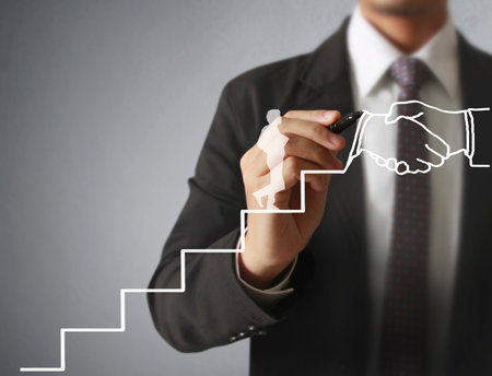 Businessman drawing graphics a growing graphの写真素材