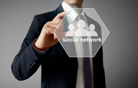 male touching virtual icon of social networkの写真素材