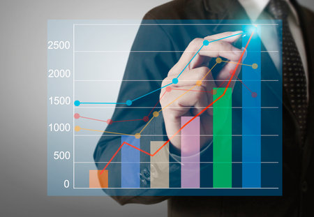 Businessman drawing graphics a growing graphの写真素材