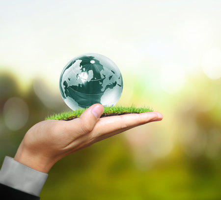 Globe ,earth in human hand, hand holding our planet earth glowingの写真素材