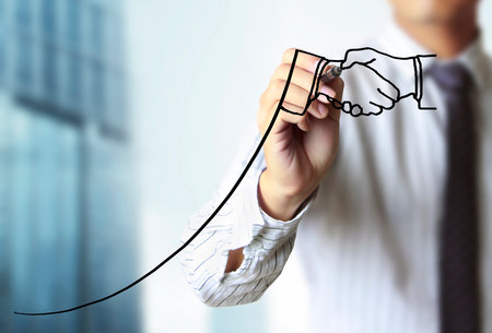 Businessman drawing graphics a growing graphの写真素材