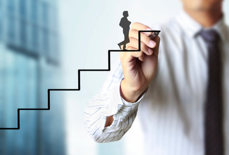 Businessman drawing graphics a growing graphの写真素材