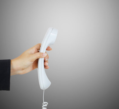 Close up on female hand holding phoneの写真素材