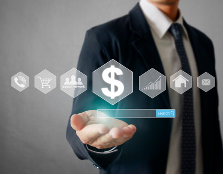 Businessman with financial symbols comingの写真素材