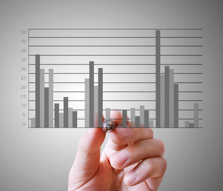 Businessman drawing graphics a growing graphの写真素材
