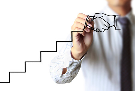 Businessman drawing graphics a growing graphの写真素材