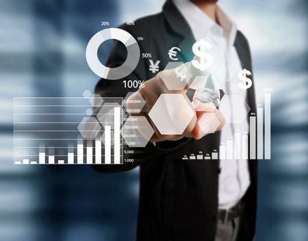 businessman with financial symbols coming from handの写真素材