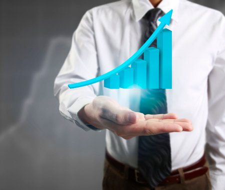 Businessman with financial symbols comingの写真素材