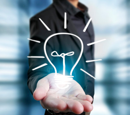 Green energy symbols ecology, light bulb in hand
