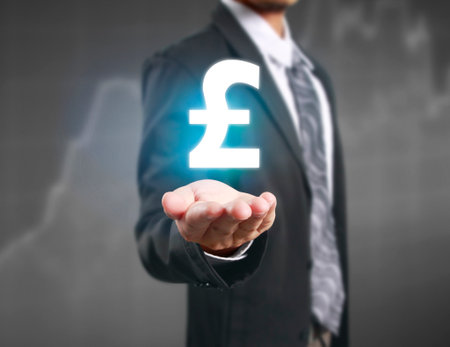 businessman with financial symbols coming from handの写真素材