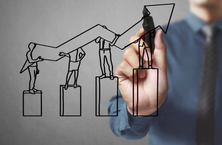 Businessman drawing graphics a growing graphの写真素材