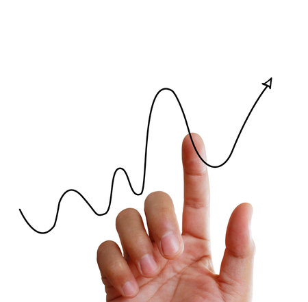 businessman with financial symbols coming from handの写真素材