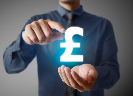 businessman with financial symbols coming from handの写真素材