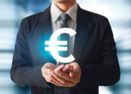 businessman with financial symbols coming from handの写真素材