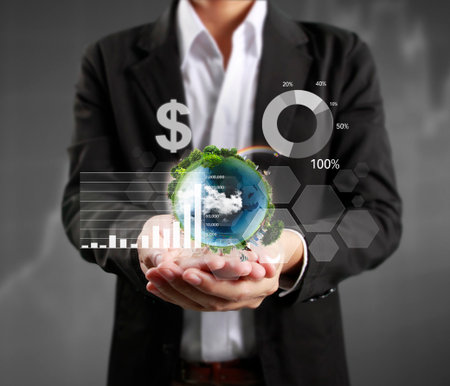 businessman with financial symbols coming from handの写真素材
