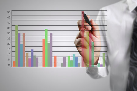 Businessman drawing graphics a growing graphの写真素材