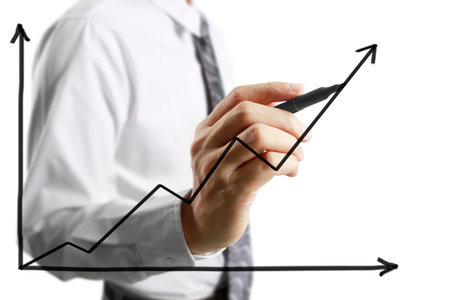 Businessman drawing graphics a growing graphの写真素材