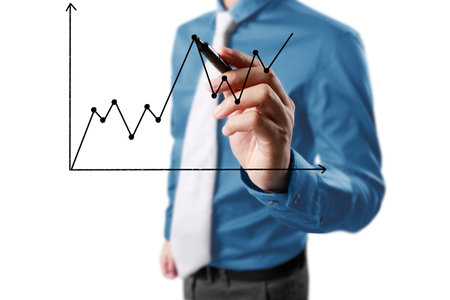 Businessman drawing graphics  growing graphの写真素材