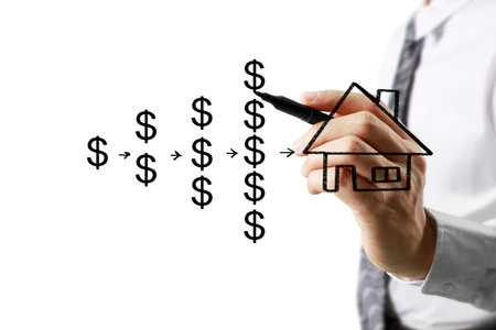 Businessman hand drawing a houseの写真素材