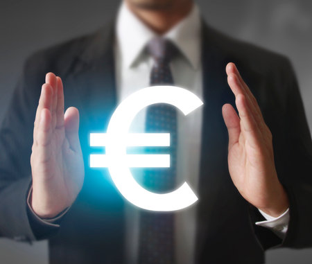 businessman with financial symbols coming from handの写真素材
