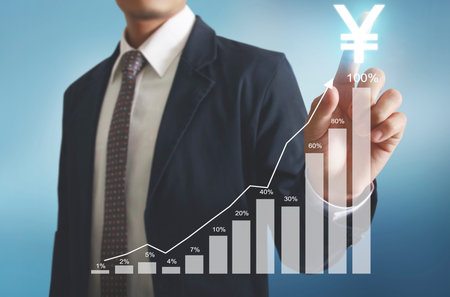 businessman with financial symbols coming from handの写真素材