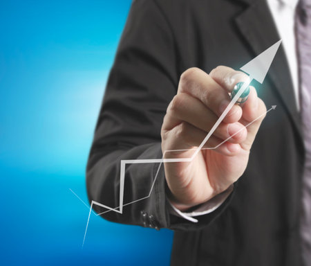 Businessman drawing graphics a growing graphの写真素材