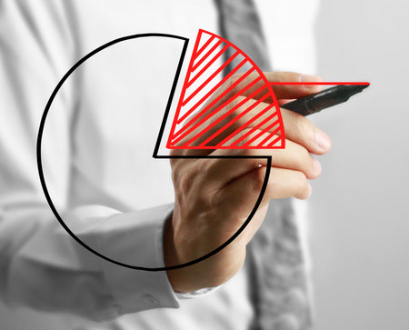 Businessman drawing graphics growing graphの写真素材