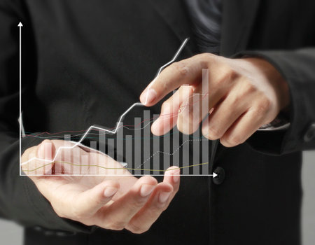 financial symbols coming from handの写真素材