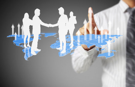 businessman with financial symbols coming from handの写真素材